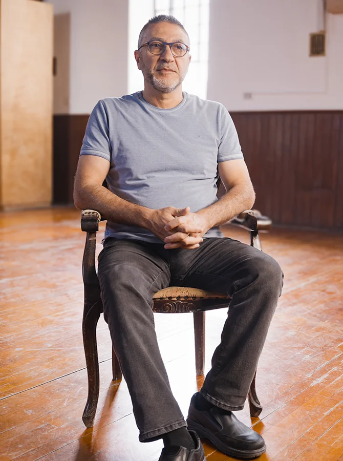 A man sitting in an interview chair