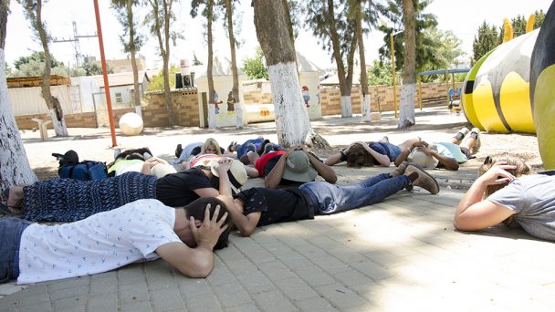 people in Israel sheltering from rockets during the crisis