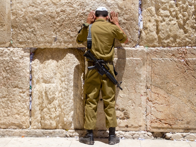Israeli soldier praying at the Western Wall