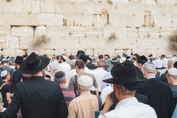 group of people at the western wall
