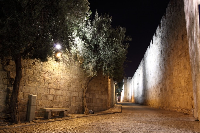 lit street by the old city walls
