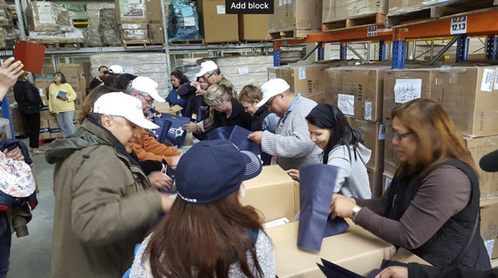 people packing boxes at the joseph project