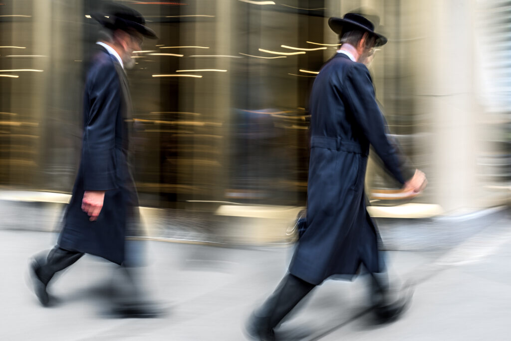 abstract image of jewish business people in the street and modern style with a blurred background