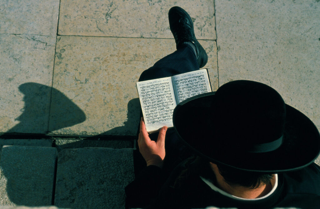 Orthodox Jew reading at the Kotel, also called Western Wall or wailing wall