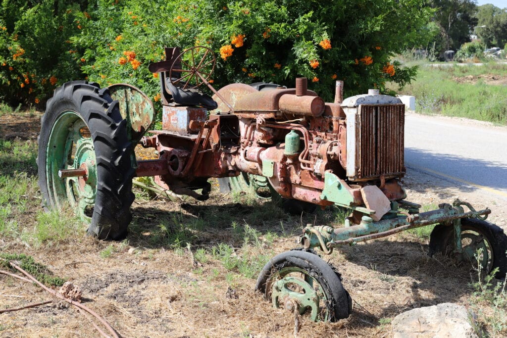 Old agricultural equipment at a kibbutz in Israel. The founders of Yad HaShmona originally intended to found a believing kibbutz.