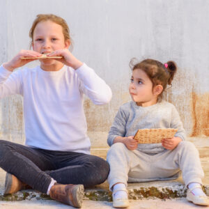 Two girls celebrating the Jewish holiday of Passover