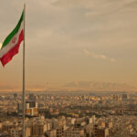 Iranian flag over Tehran after unprecedented attack on Israel