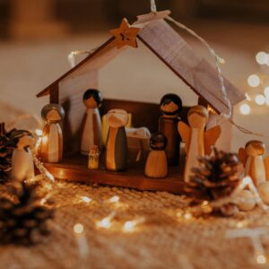 christmas story in nativity scene lit with lovely soft white lights