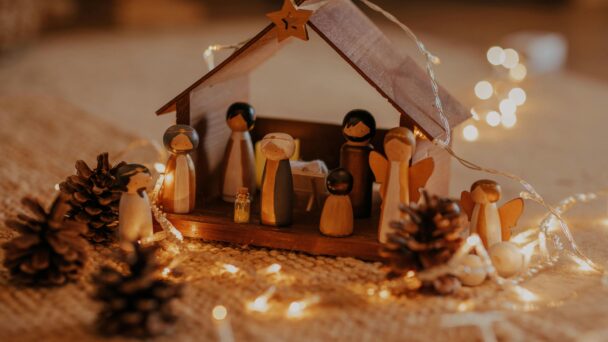 christmas story in nativity scene lit with lovely soft white lights